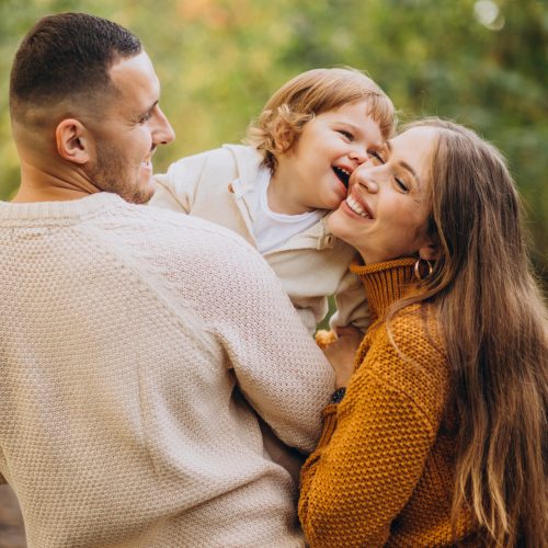 Young family with children in autumn park